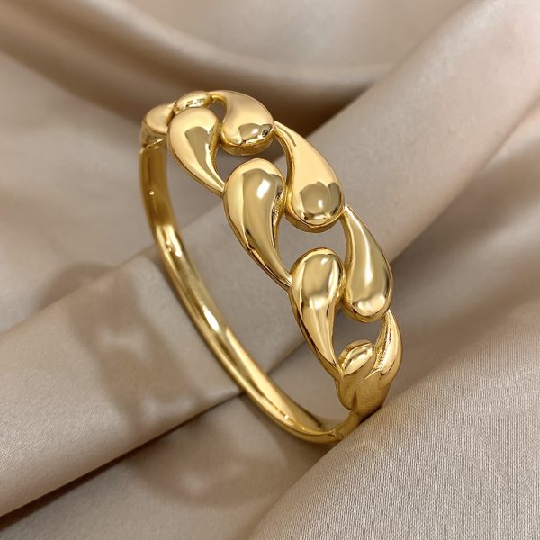 Chic Golden-Tone Stainless Steel Bangle with Unique Water Drop Design for Women - Perfect for Casual Attire